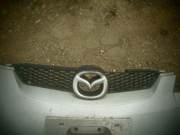 Решетка радиатора Mazda Demio